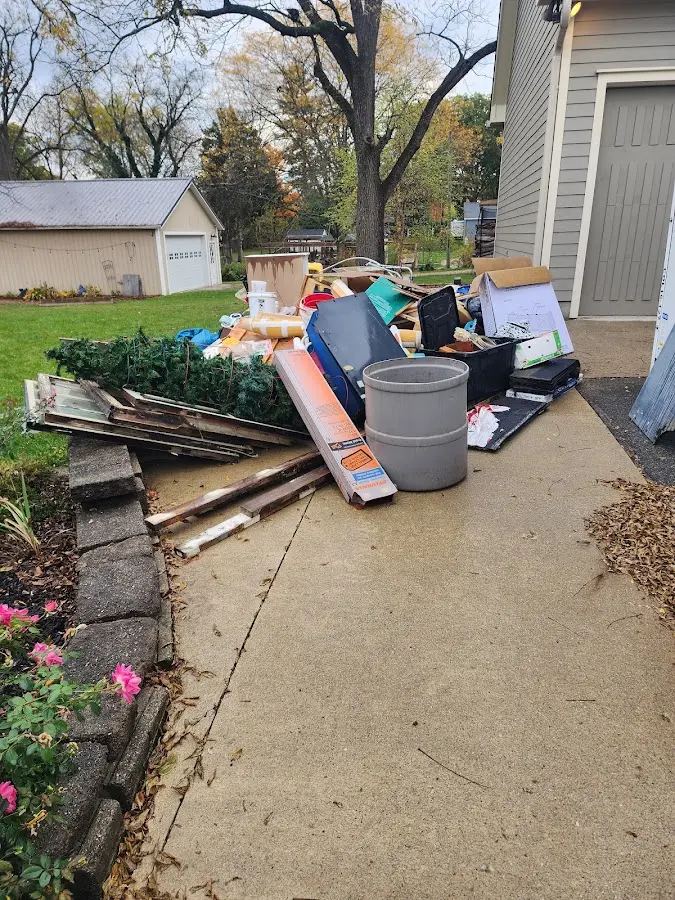 Dumpster being loaded with debris for 30 Yard Dumpster Rental in Hillsboro